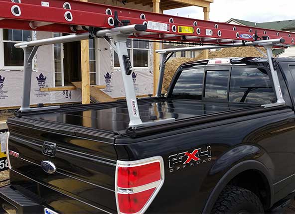 A christmas tree in the back of a truck.